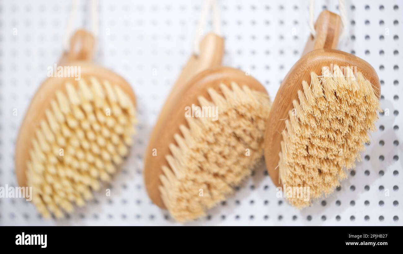 kitchen brushes hang in supermarket Stock Photo