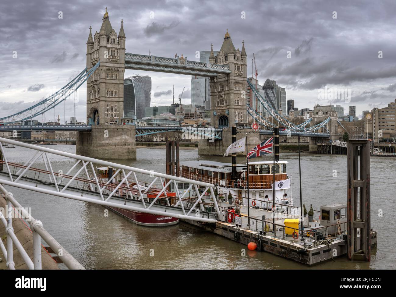 The iconic Tower Bridge, recognised throughout the world, is a Grade I Listed building and crosses the River Thames near the Tower of London and City Stock Photo