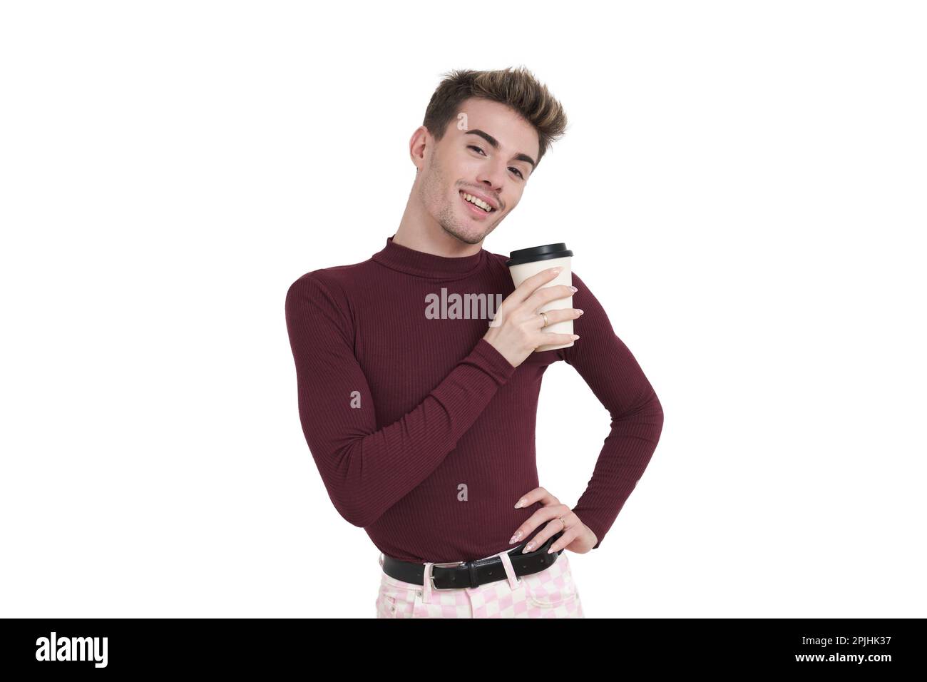 Young caucasian man smiling with a coffee cup, isolated. Stock Photo