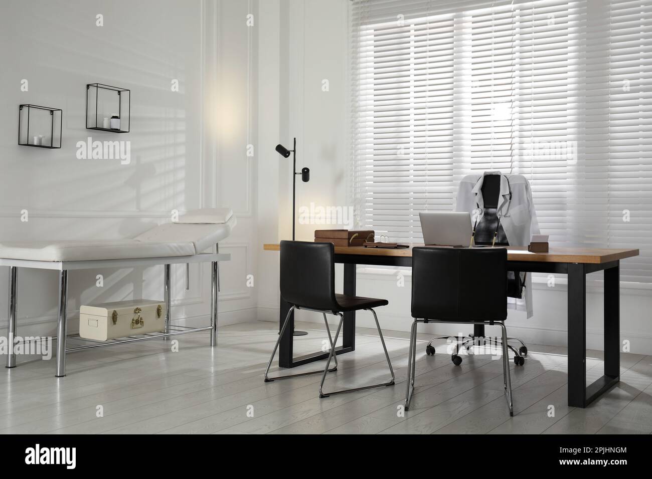 Modern medical office interior with doctor's workplace and examination ...