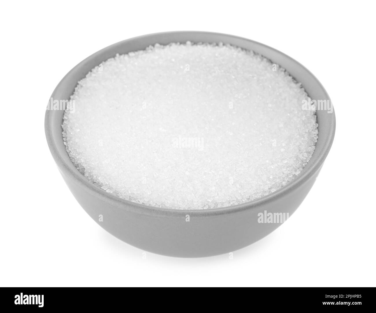 Granulated sugar in bowl isolated on white Stock Photo