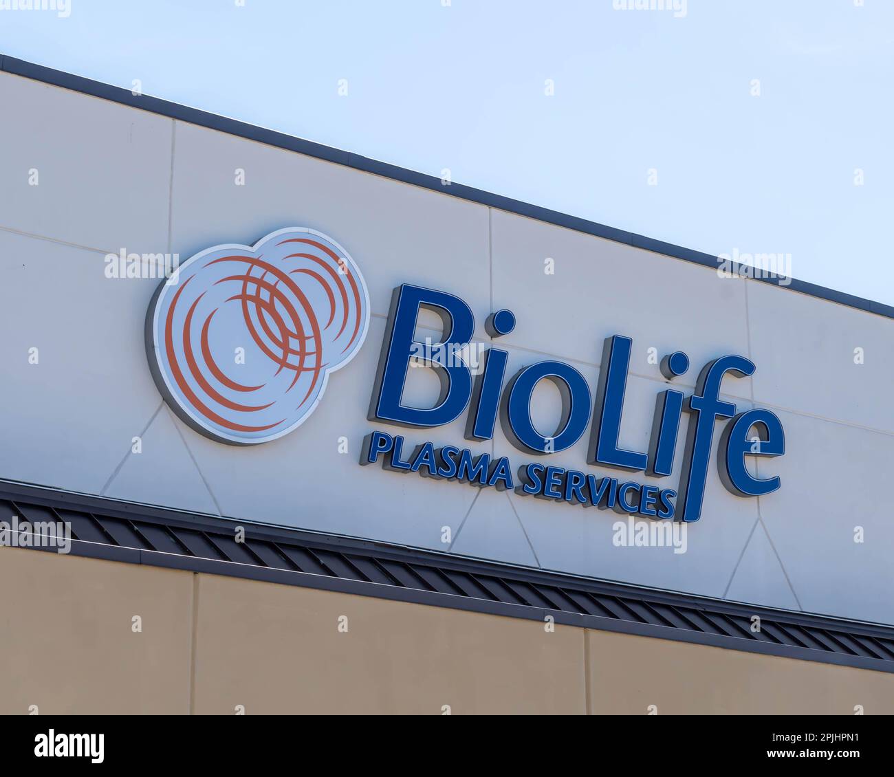 The BioLife Plasma Services sign on the building in the Edgewood Town
