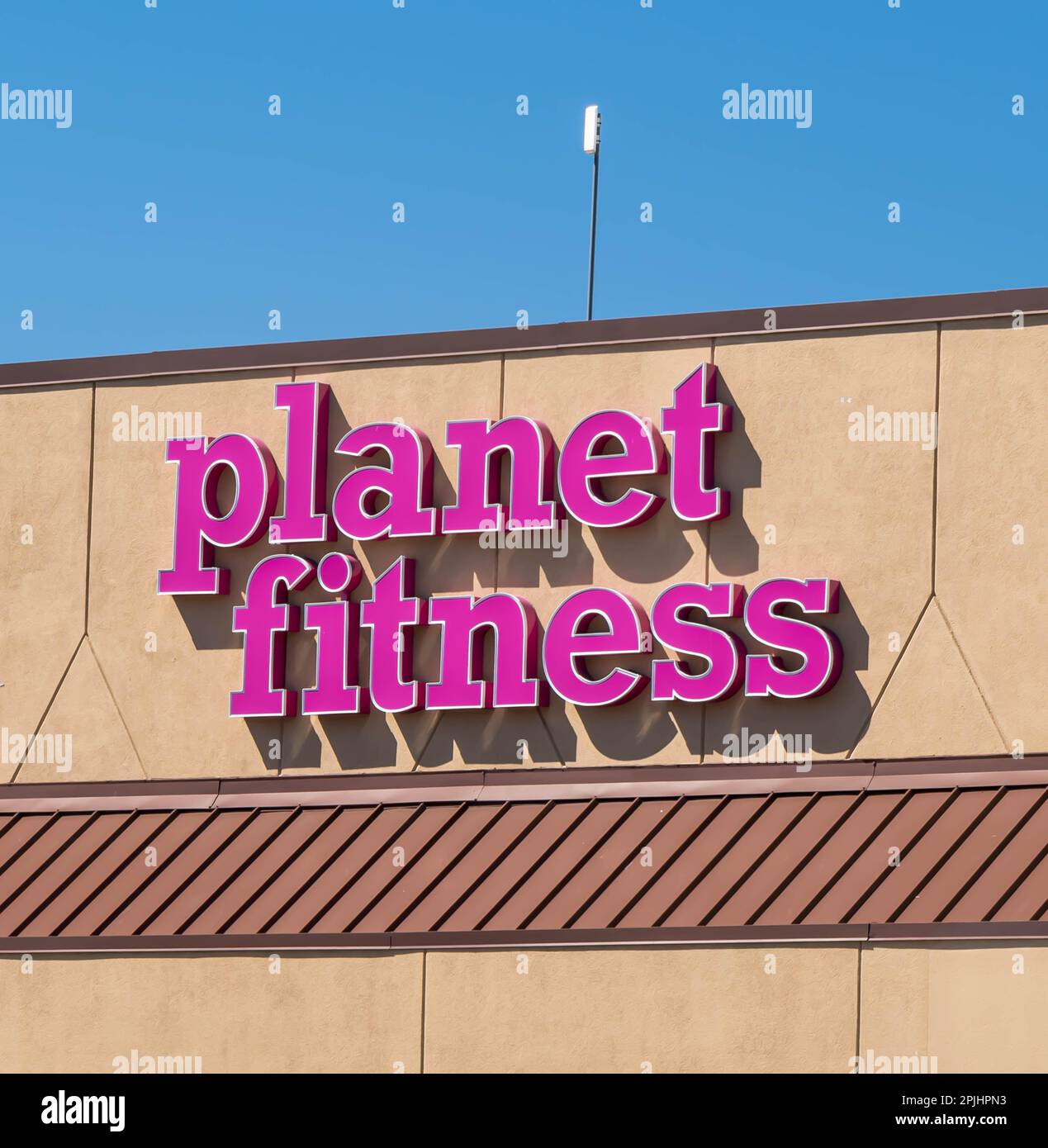 The Planet Fitness sign on the building in the Edgewood Town Center in ...
