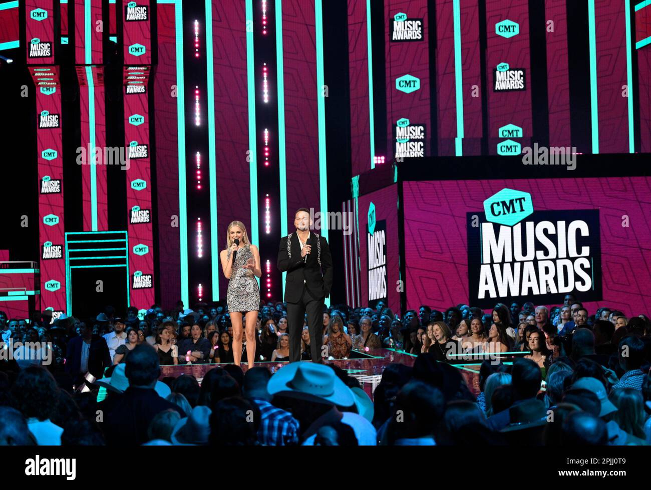 Hosts Kelsea Ballerini, left, and Kane Brown speak at the CMT Music
