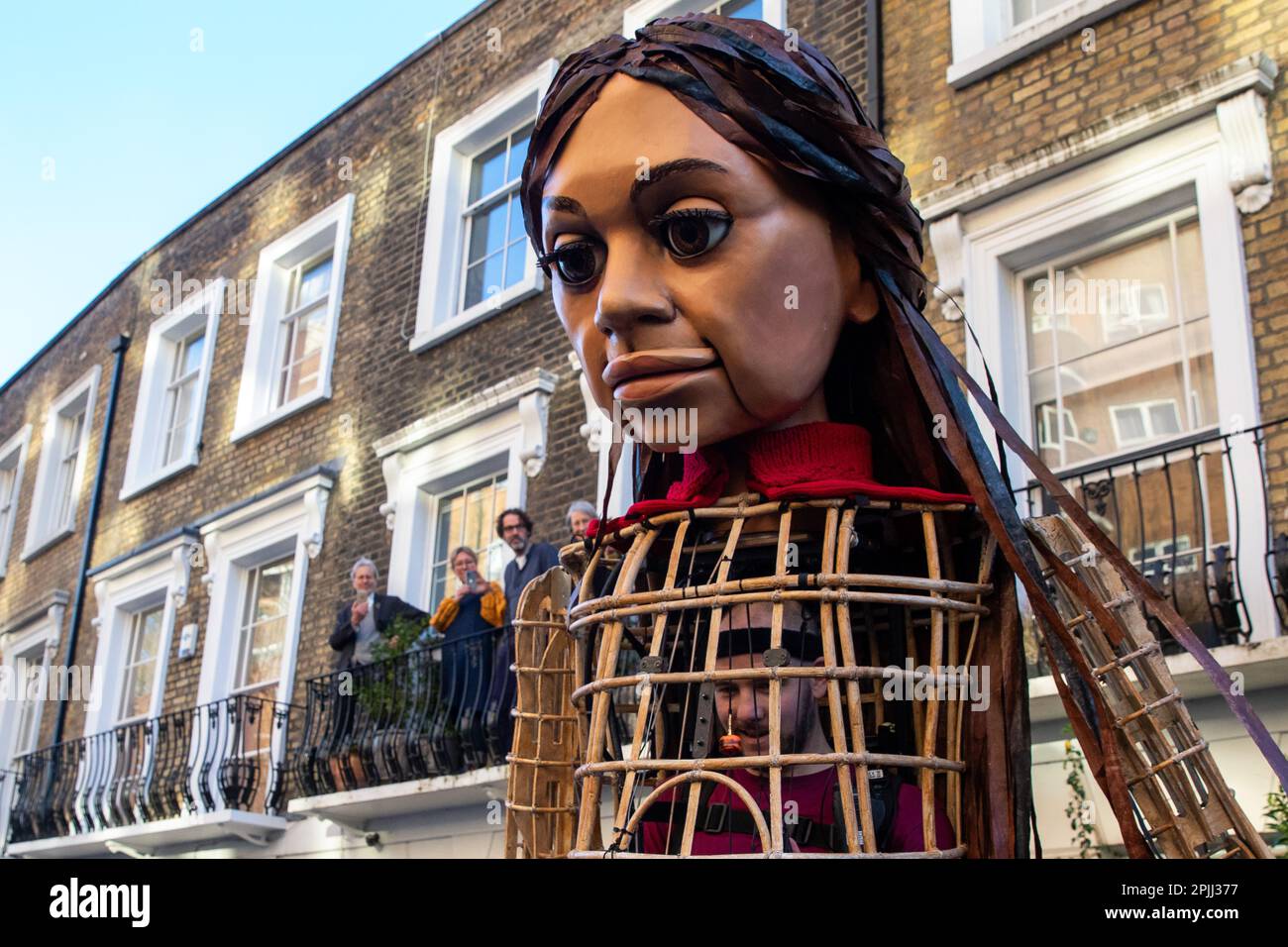 London uk 2nd april 2023 local residents watch little amal a 12
