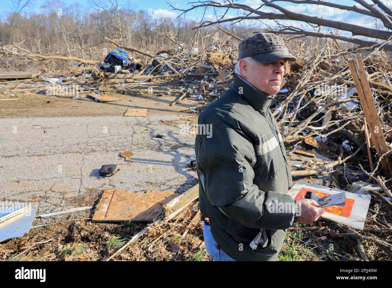 STINESVILLE, INDIANA APRIL 1 Don Hill collects family photos after a