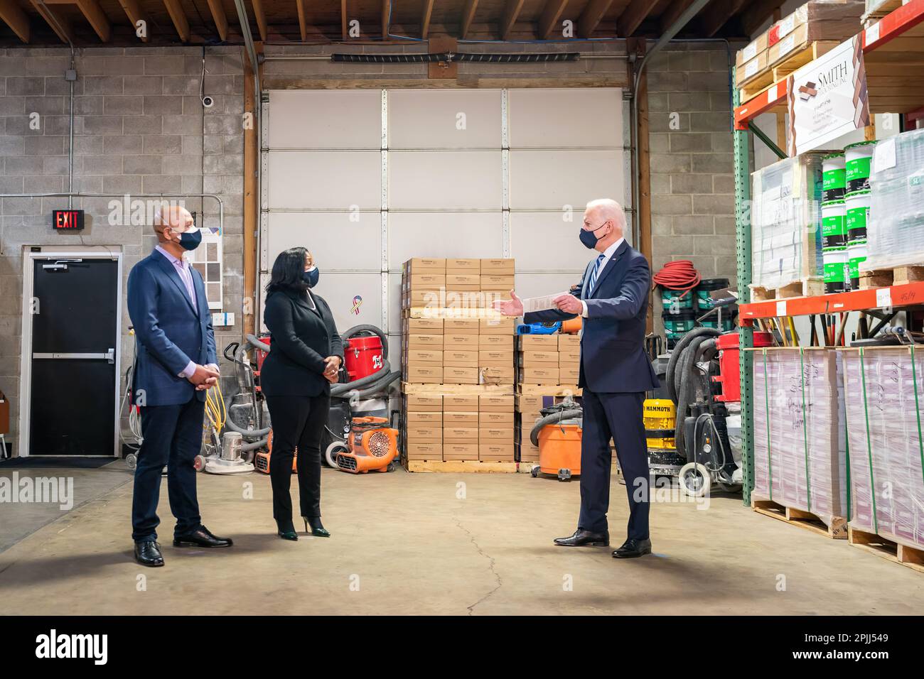 President Joe Biden talks with the owners of Smith Flooring Kristin Smith and James Smith Tuesday, March 16, 2021, at their store in Chester, Pennsylvania. (Official White House Photo by Adam Schultz) Stock Photo