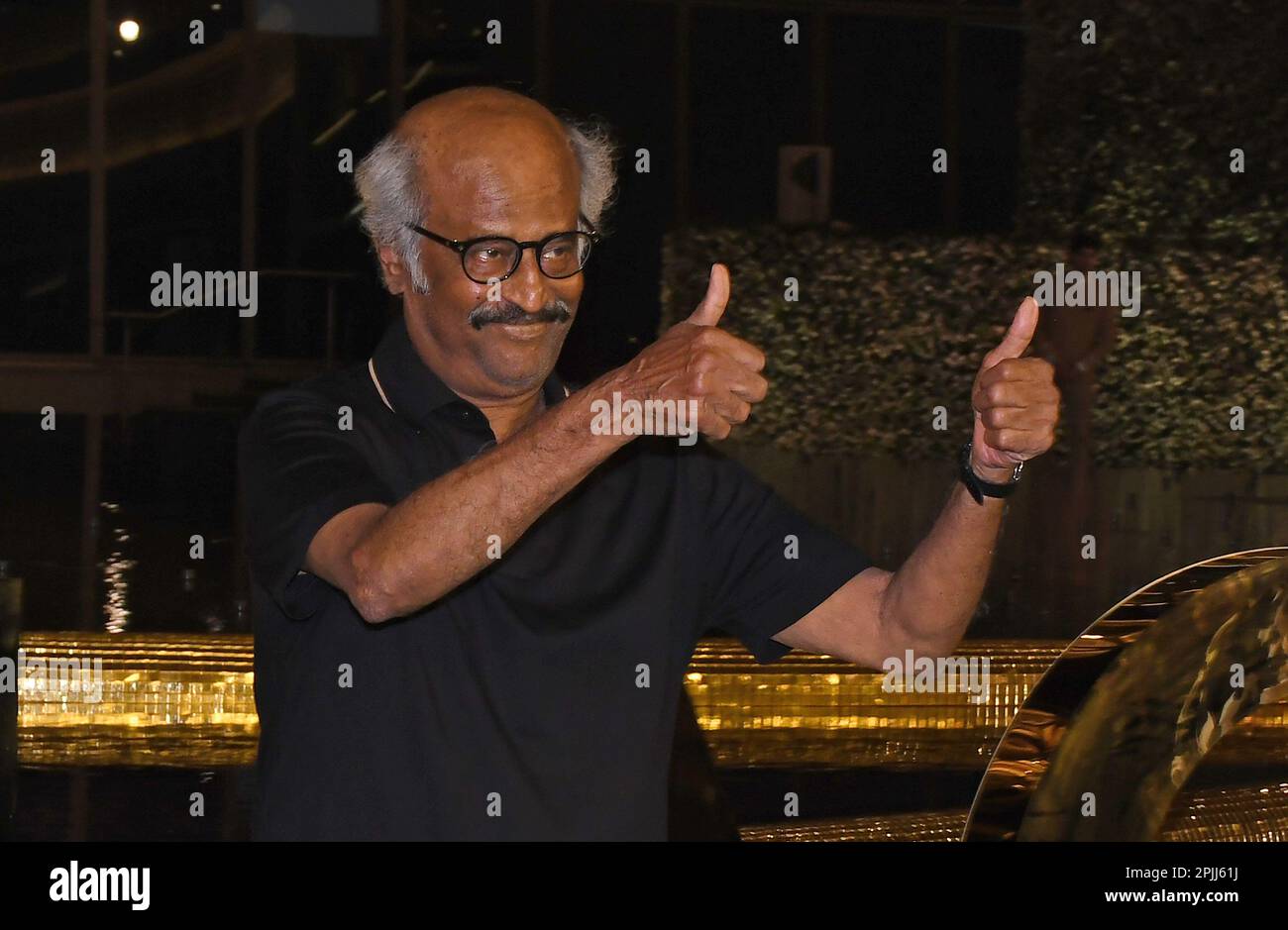 Mumbai, India. 31st Mar, 2023. Bollywood actor Rajnikanth shows a thumbs up sign as he poses for a photo at the inauguration of Nita Mukesh Ambani Cultural Centre (NMACC) in Mumbai. Credit: SOPA Images Limited/Alamy Live News Stock Photo