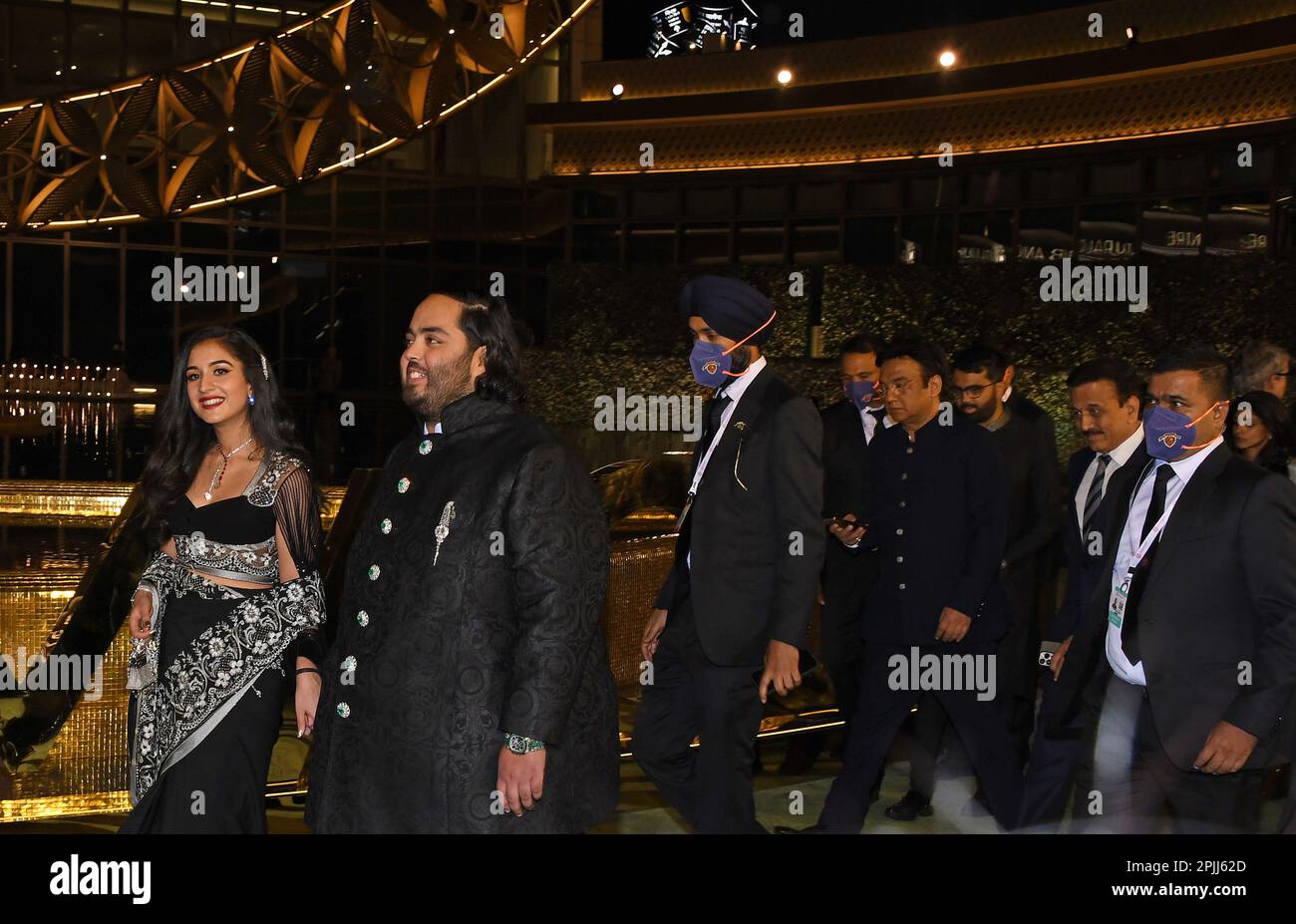 Mumbai, India. 31st Mar, 2023. L-R Radhika Merchant (fiancé) and Anant Ambani walk with security personnel during the inauguration of Nita Mukesh Ambani Cultural Centre (NMACC) in Mumbai. Credit: SOPA Images Limited/Alamy Live News Stock Photo