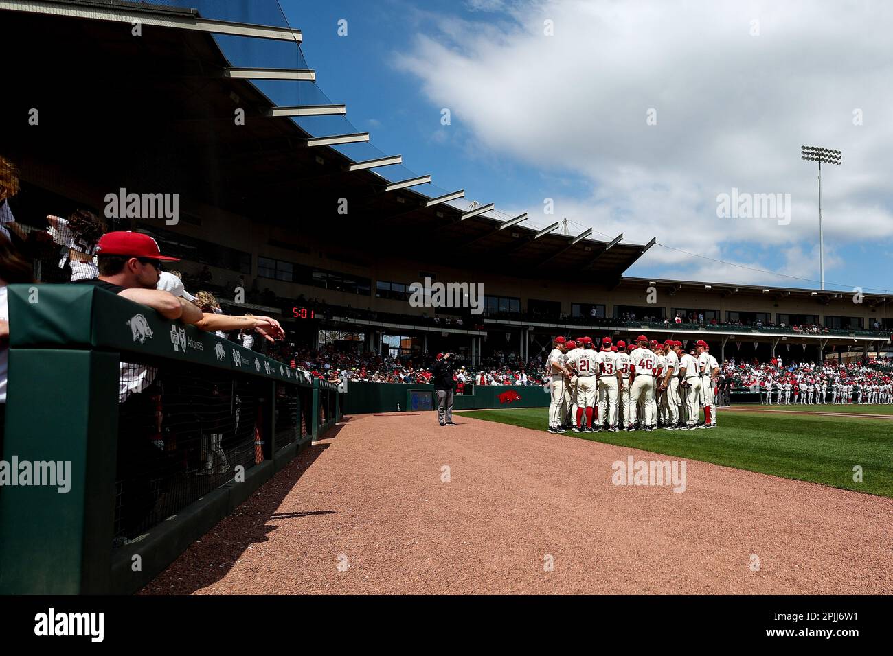 April 2, 2023: The Razorback baseball team gathers prior to them lining up for the National Anthem. Arkansas defeated Alabama 5-4 in Fayetteville, AR, Richey Miller/CSM(Credit Image: © Richey Miller/Cal Sport Media) Stock Photo