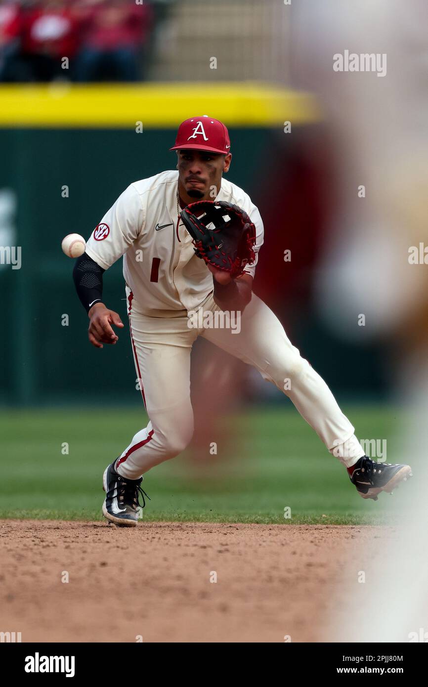 April 2, 2023: Razorback short stop Harold Coll #1 eyes a bouncing ball ...