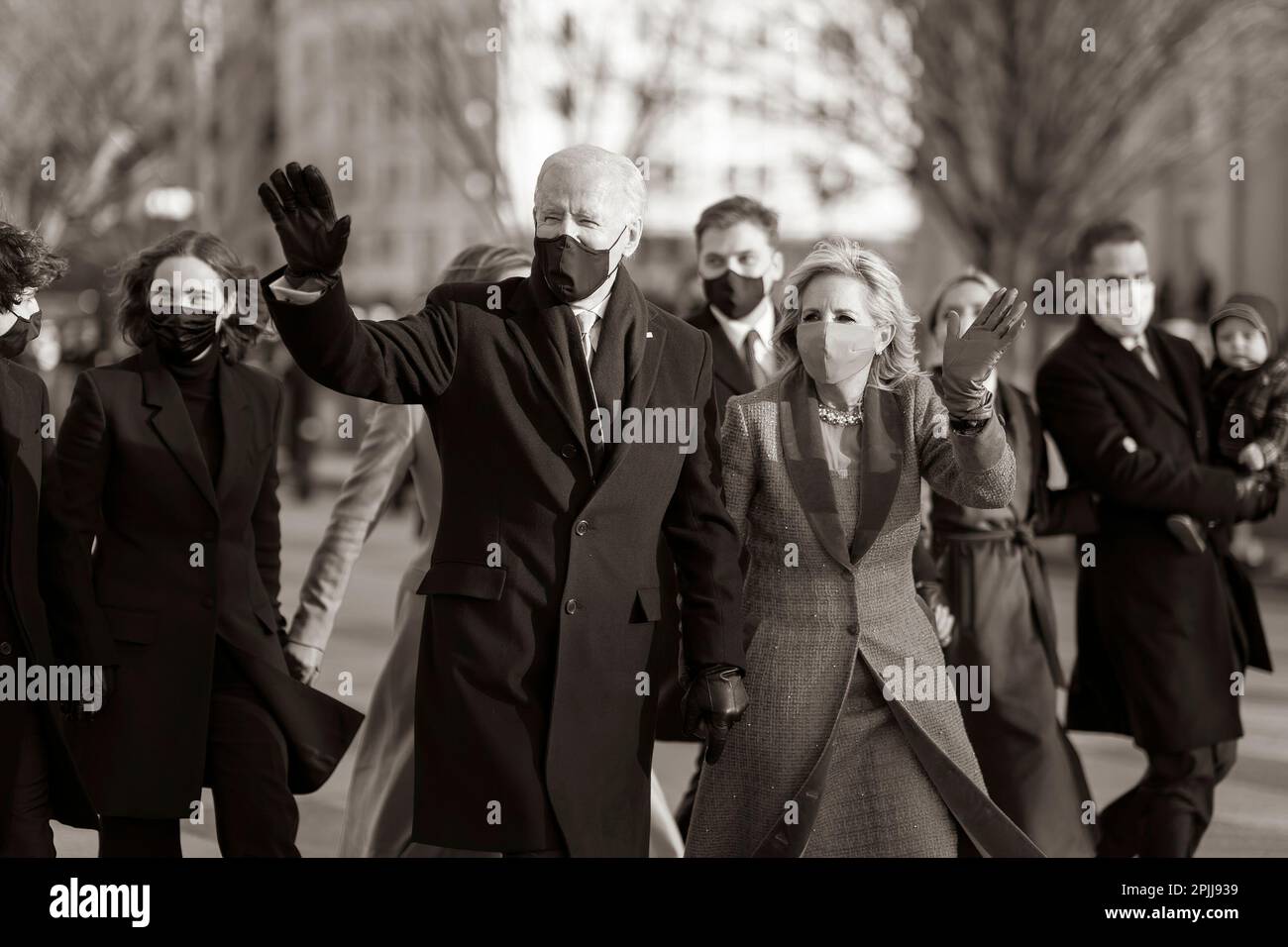 P20210120AS: President Joe Biden and First Lady Dr. Jill Biden wave Wednesday, Jan. 20, 2021, as they walk along Pennsylvania Ave. to the White House during the inaugural parade. (Official White House Photo by Adam Schultz) Stock Photo