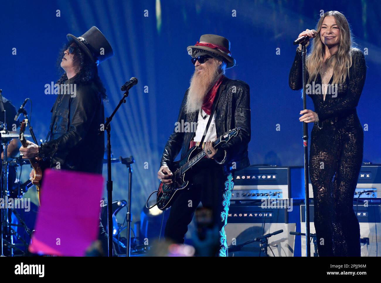 Slash, from left, Billy Gibbons and LeAnn Rimes perform during a Lynyrd