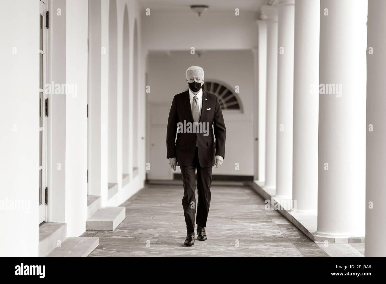 P20210121AS-0485: President Joe Biden walks along the Colonnade Thursday, Jan. 21, 2021, to the Oval Office of the White House. (Official White House Photo by Adam Schultz) Stock Photo