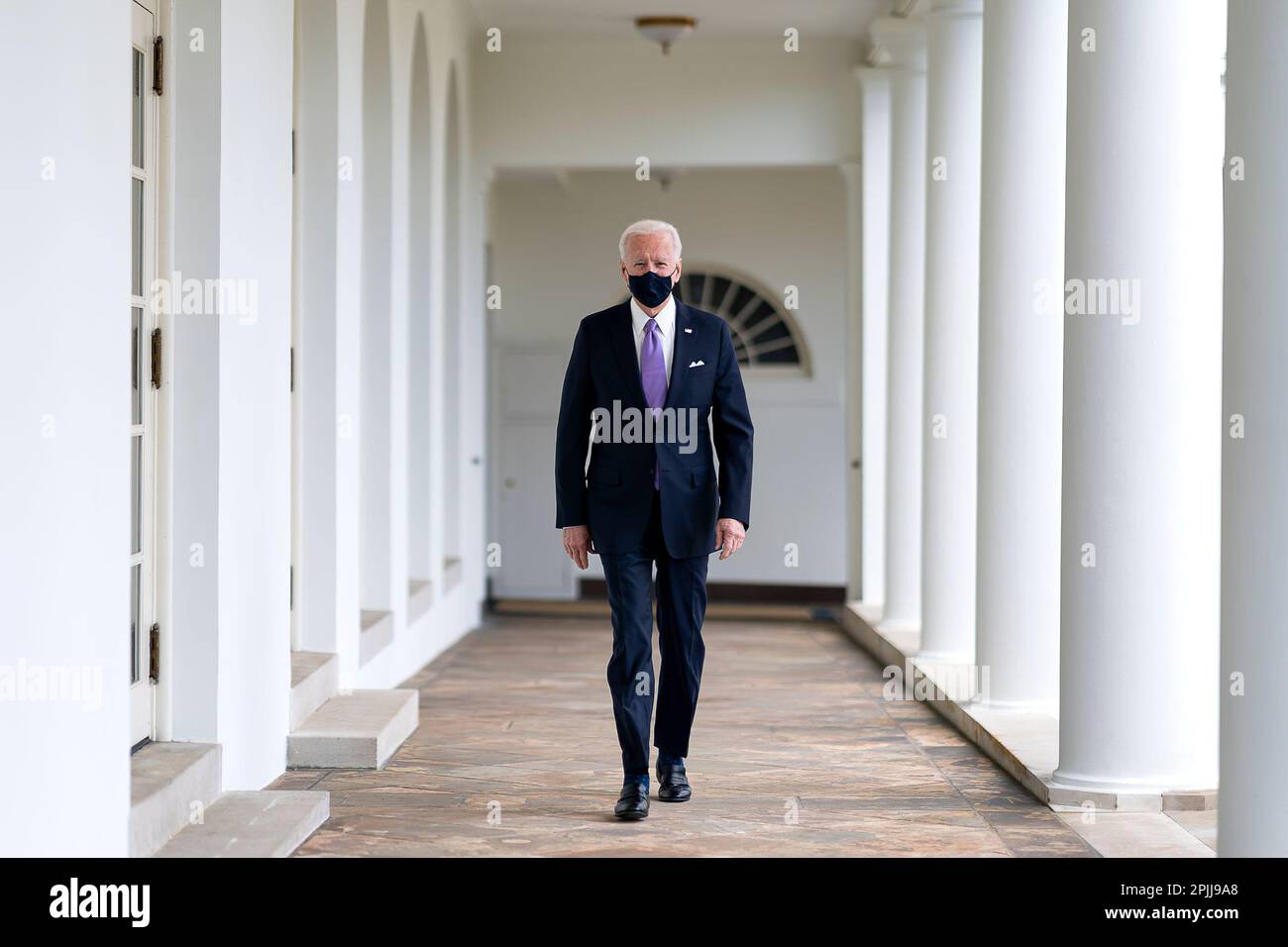P20210121AS-0485: President Joe Biden walks along the Colonnade Thursday, Jan. 21, 2021, to the Oval Office of the White House. (Official White House Photo by Adam Schultz) Stock Photo