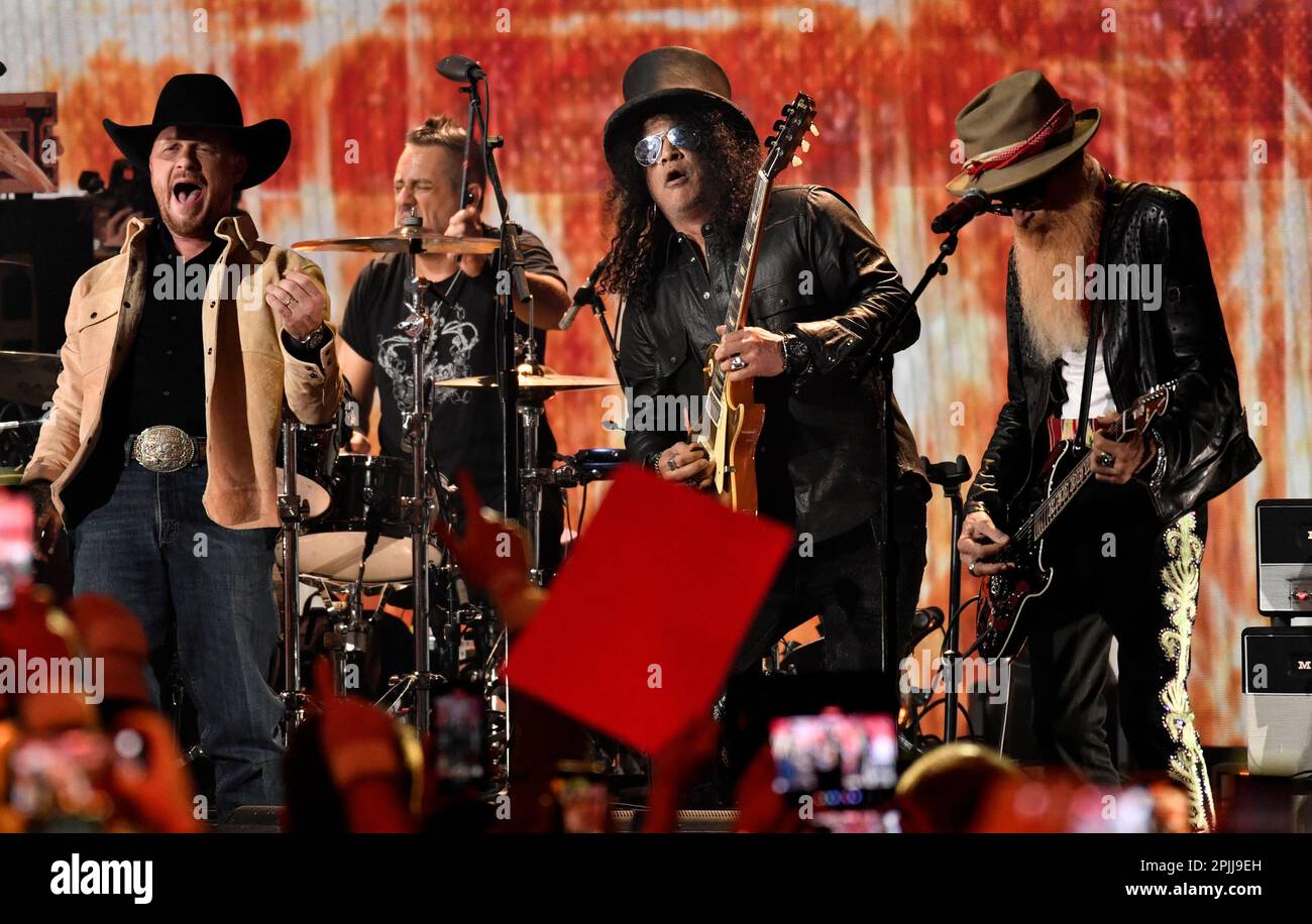 Cody Johnson, from left, Slash and Billy Gibbons perform during a