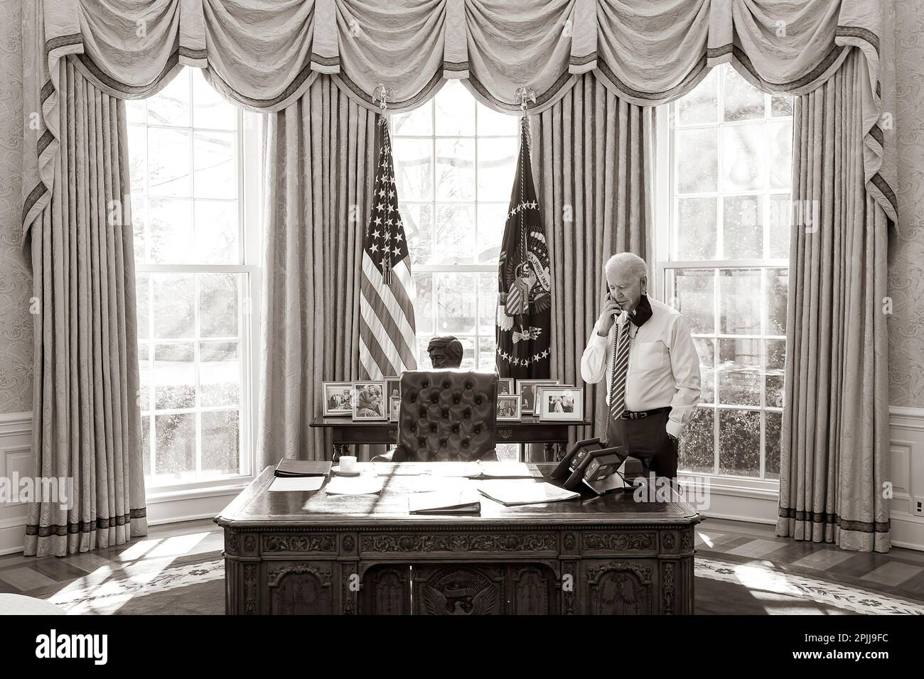 P20210122AS-0386: President Joe Biden talks on the phone with Mexico’s President Andrés Manuel López Obrador Friday, Jan. 22, 2021, in the Oval Office of the White House. (Official White House Photo by Adam Schultz) Stock Photo