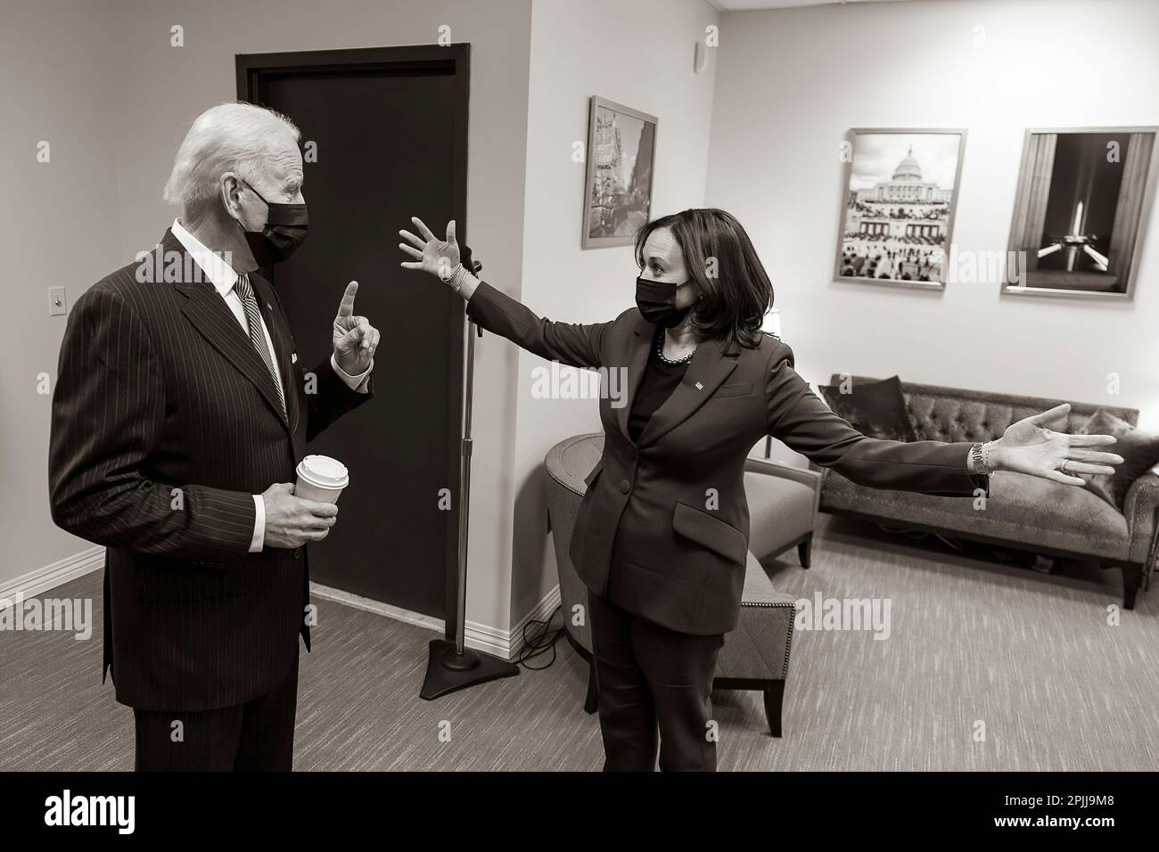 P20210125AS-1177: Vice President Kamala Harris opens her arms as she talks with President Joe Biden outside the South Court Auditorium in the Eisenhower Executive Office Building at the White House Monday, Jan. 25, 2021, prior to the President’s remarks and executive signing for his “Buy American” initiative.  (Official White House Photo by Adam Schultz) Stock Photo