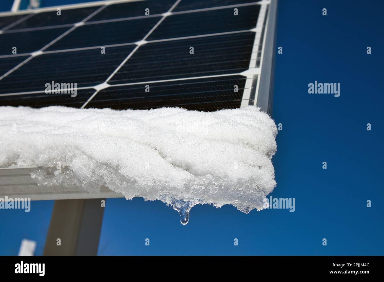 snow melting on solar panels in sunshine Stock Photo Alamy