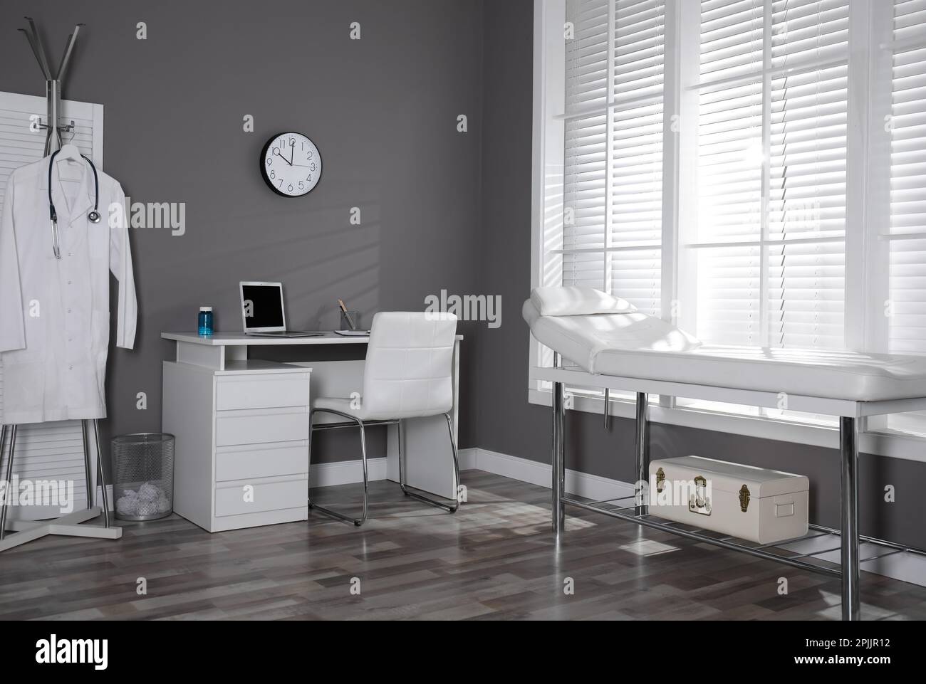Modern medical office interior with doctor's workplace and examination ...