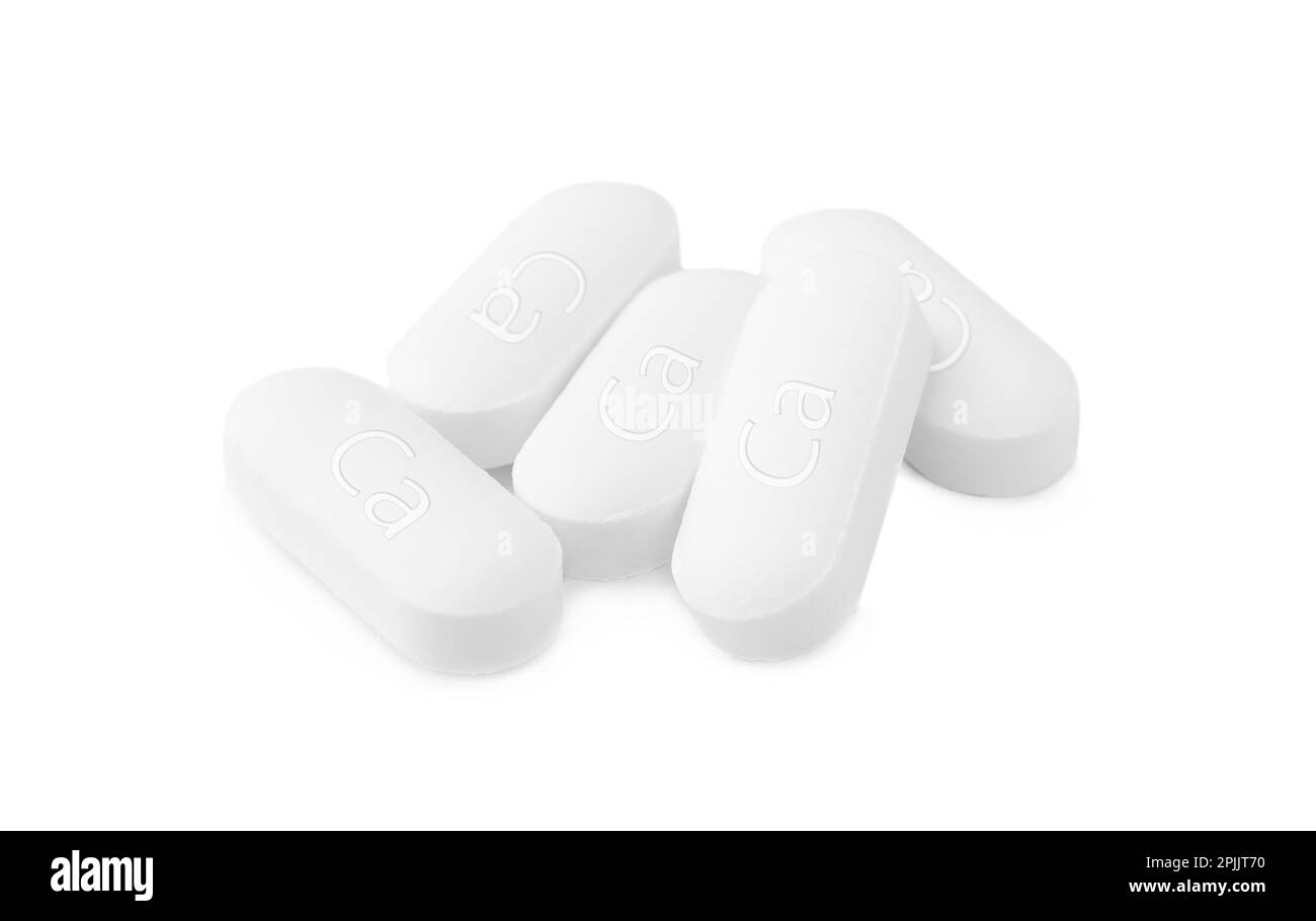 Pile of calcium supplement pills on white background Stock Photo Alamy
