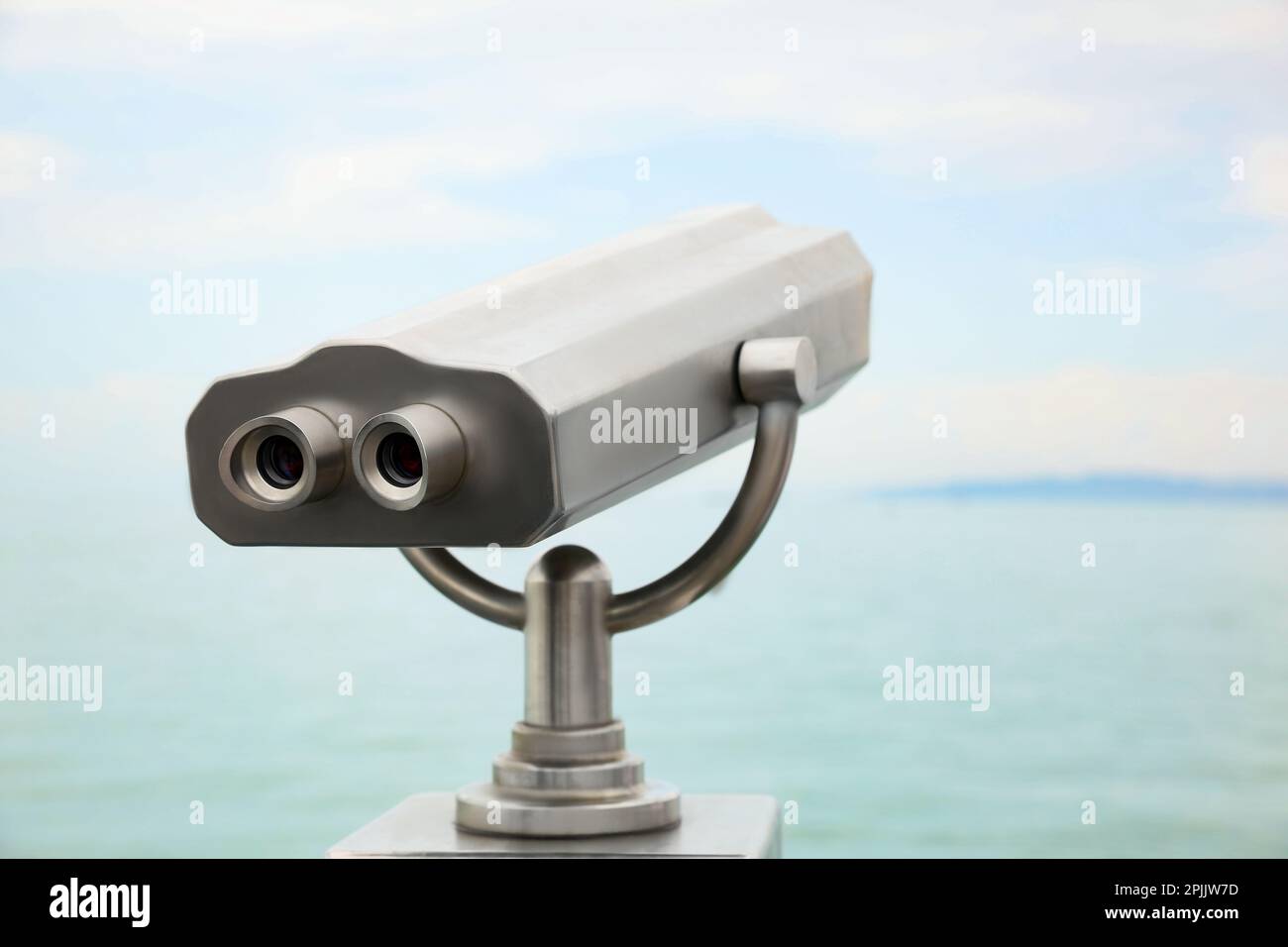 Metal tower viewer installed near sea. Mounted binoculars Stock Photo ...