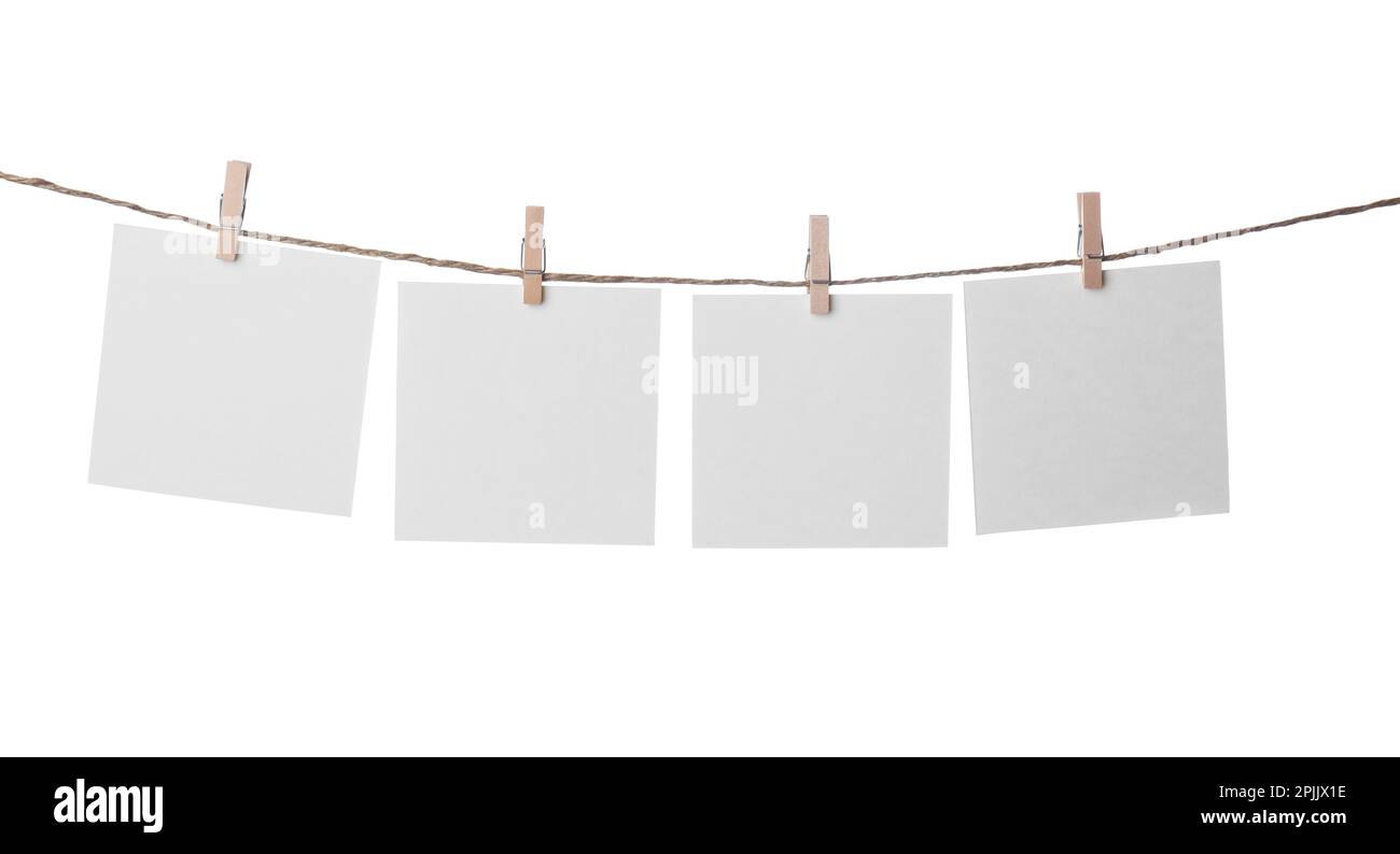 Clothespins with empty notepapers on string against white background. Space for text Stock Photo