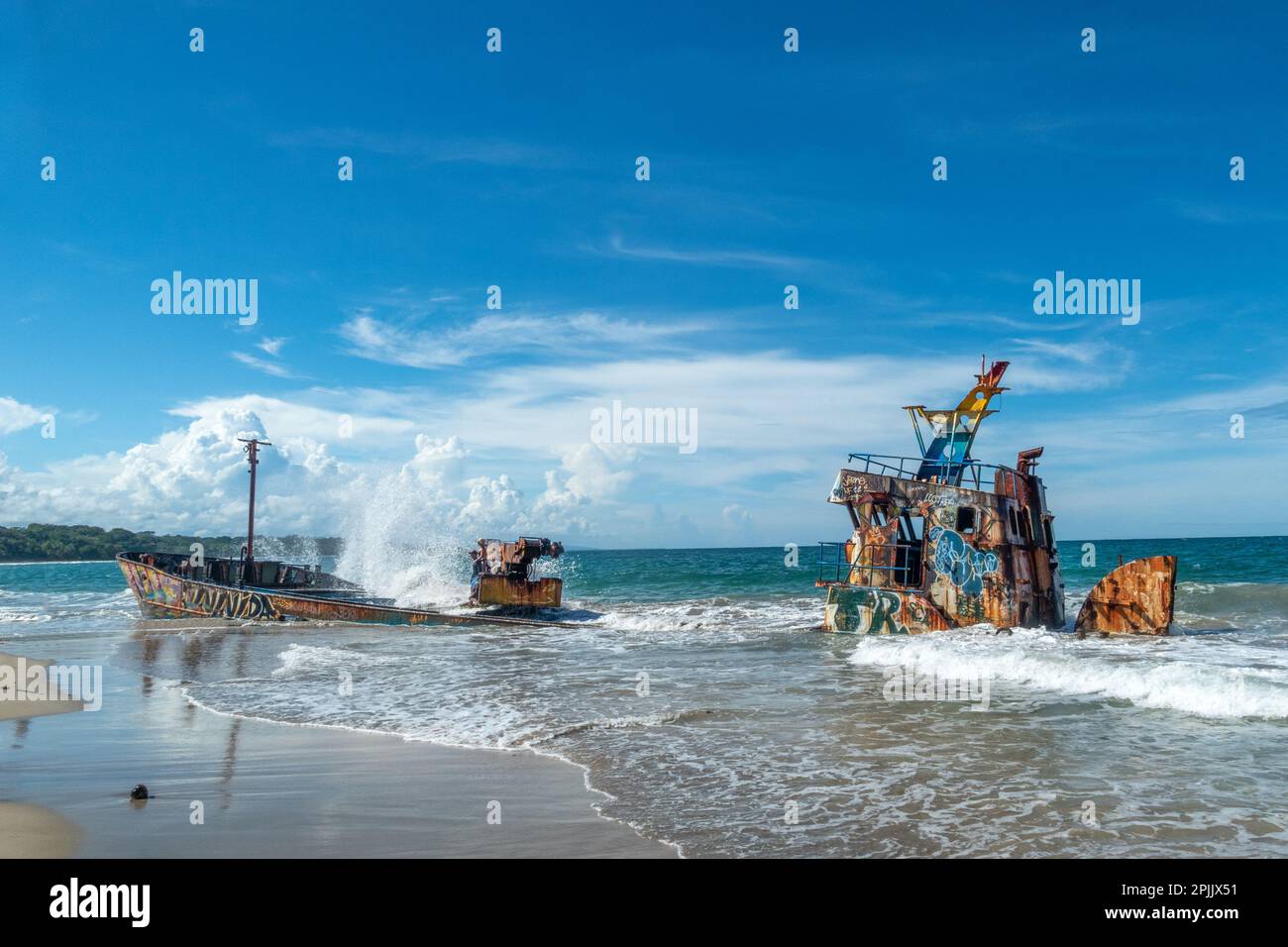 Manzanillo, Costa Rica - November 26, 2022: wander down the never-ending beach in Manzanillo, Playa Grande, with its famous shipwrecks. Stock Photo