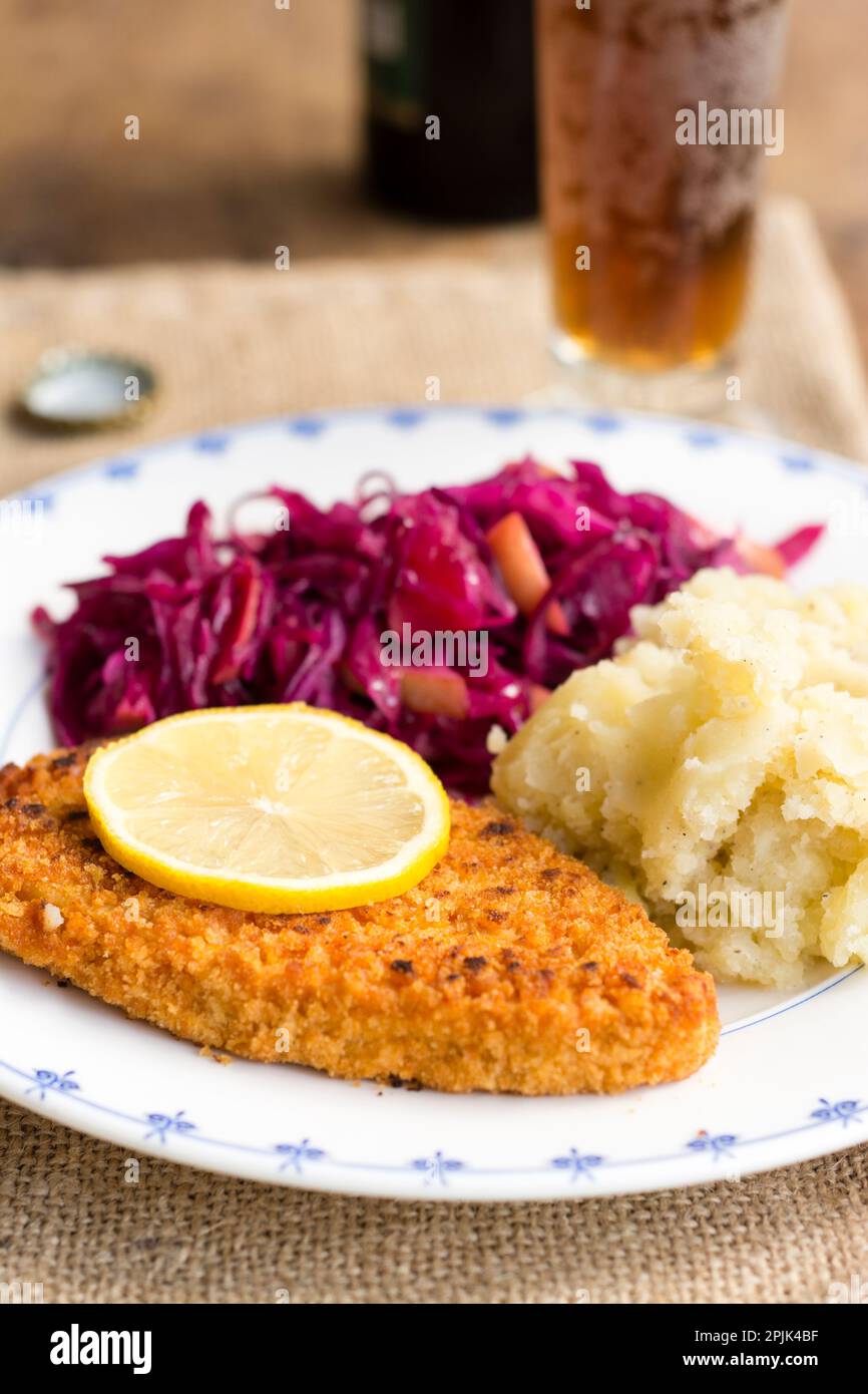 Vegan Schnitzel with Red Cabbage and Apple and Mashed Potato Stock Photo