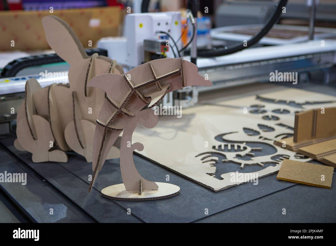 Digital die cut machine cutting corrugated cardboard products. Industrial manufacture Stock