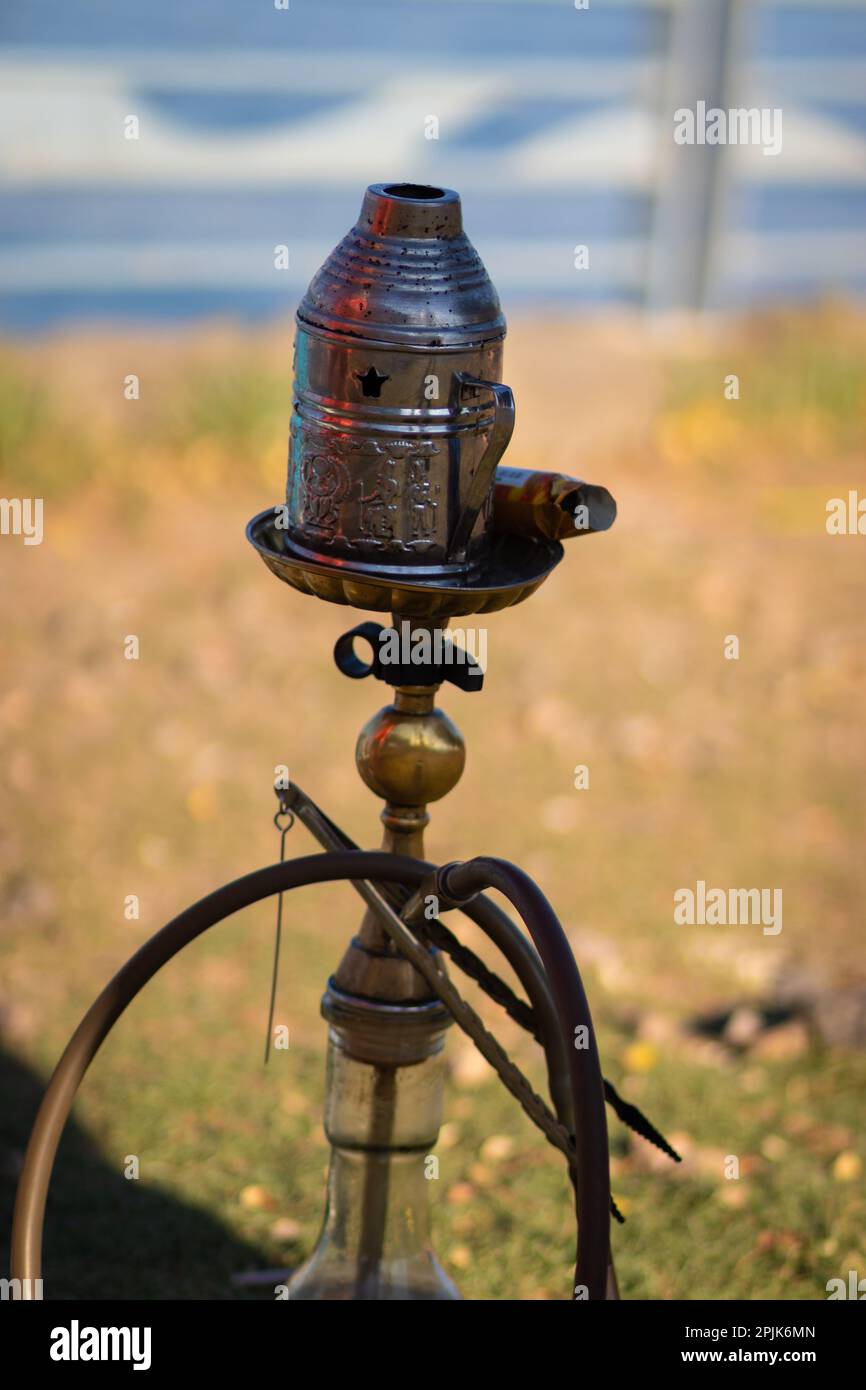 A real Syrian hookah on a beach in the Sea of Galilee Israel. Blurred