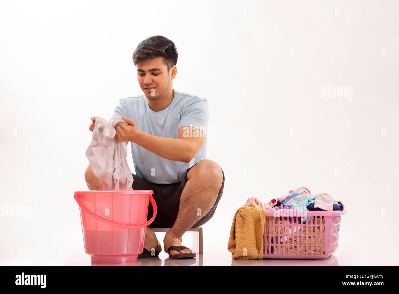 Hand Washing Laundry in a Bucket