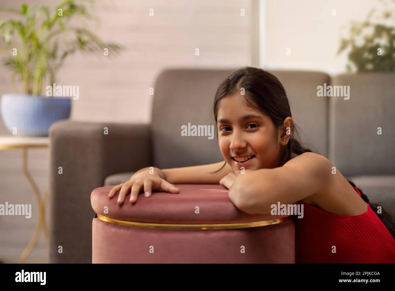 Portrait of a cheerful girl looking at camera Stock Photo - Alamy