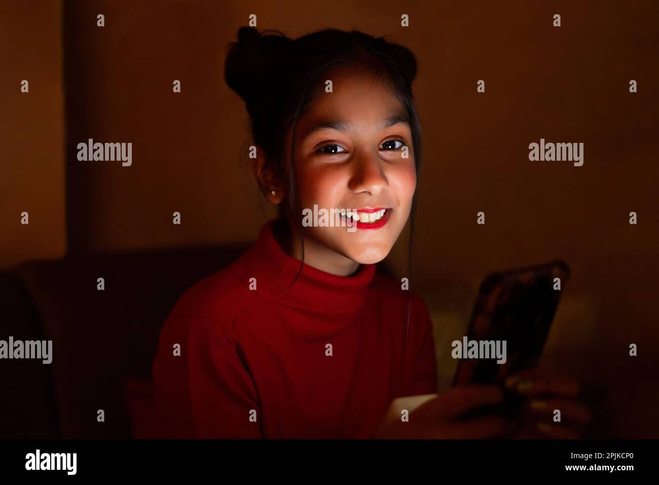 Closeup portrait of a tween girl using mobile phone Stock Photo Alamy