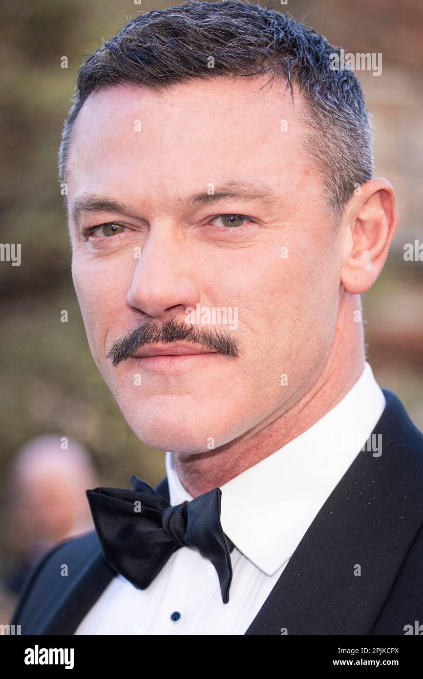 Luke Evans poses for photographers upon arrival at the Olivier Awards
