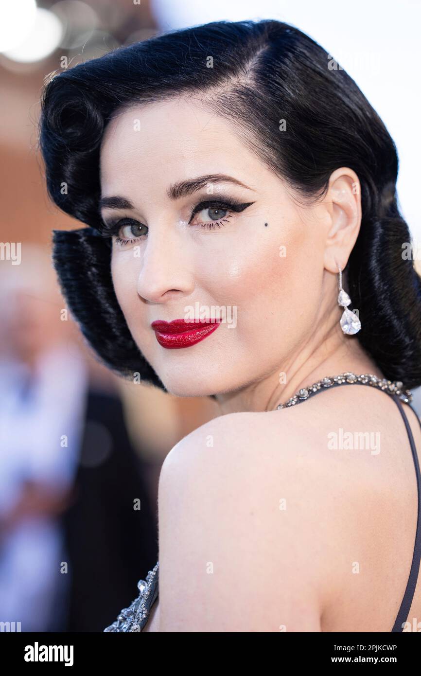 Dita Von Teese poses for photographers upon arrival at the Olivier