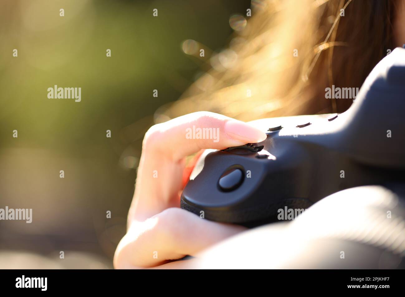 Close up of a photographer finger adjusting shutter speed with dial on mirrorless camera Stock Photo