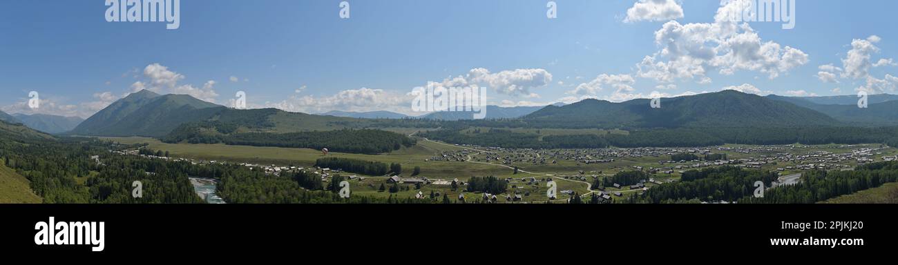 Panoramic view of Hemu Village in summer, surrounded by birch forests, in the Kanas Nature Reserve, Altai Prefecture, northern Xinjiang, China Stock Photo
