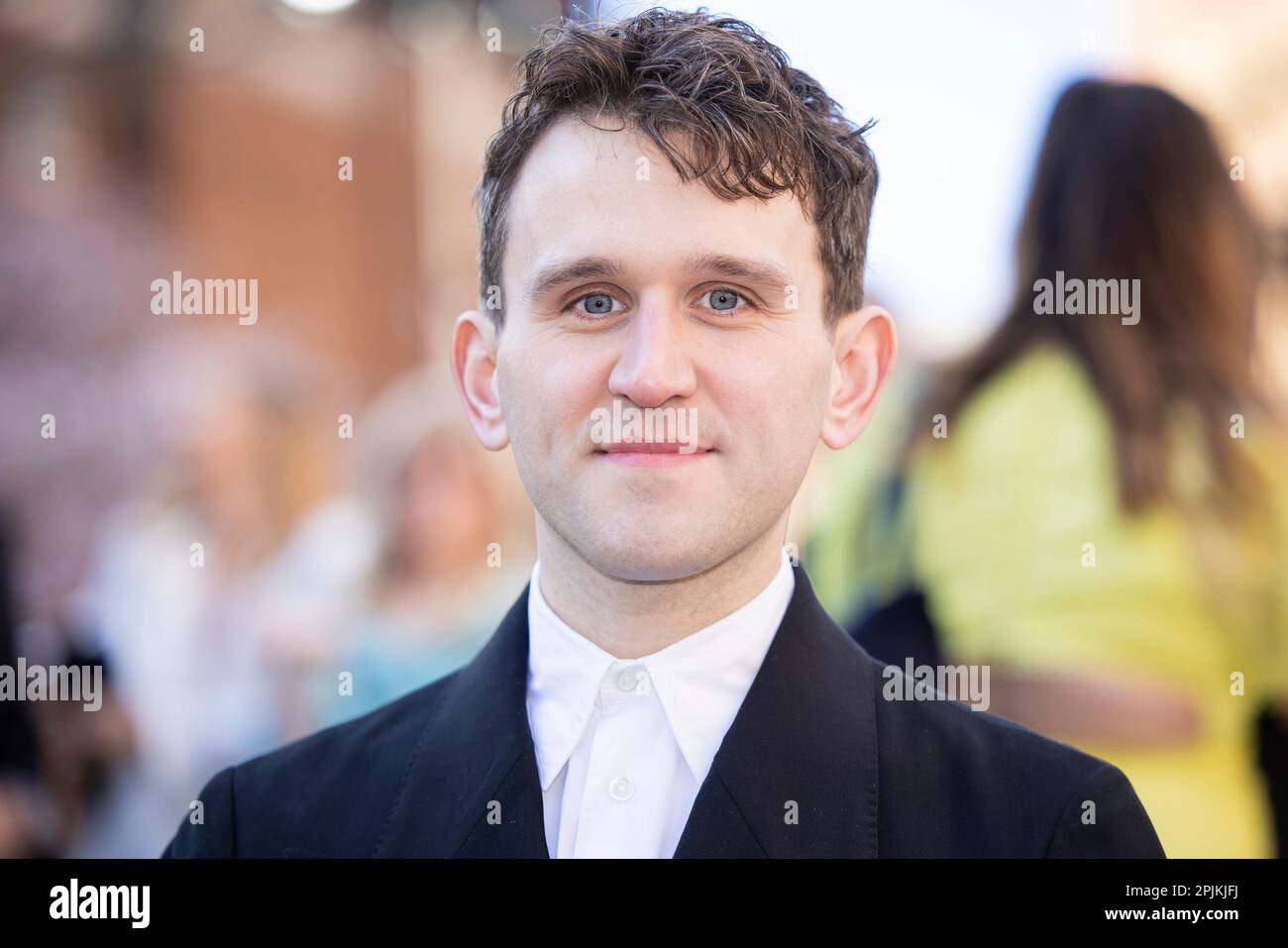 Harry Melling poses for photographers upon arrival at the Olivier
