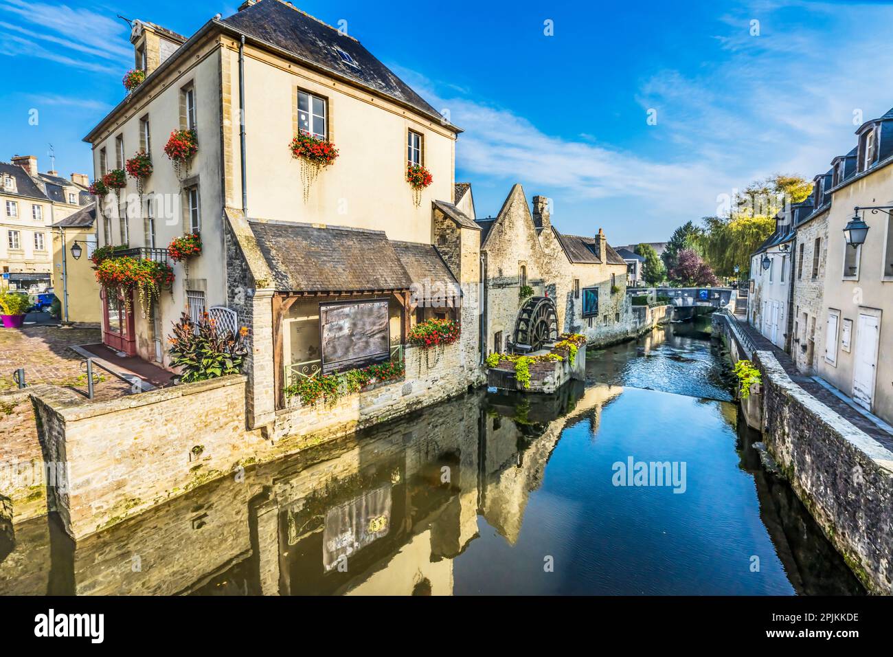 Colorful old buildings, Aure River reflection, Bayeux, Normandy, France. Bayeux founded 1st century BC, first city liberated after D-Day Stock Photo