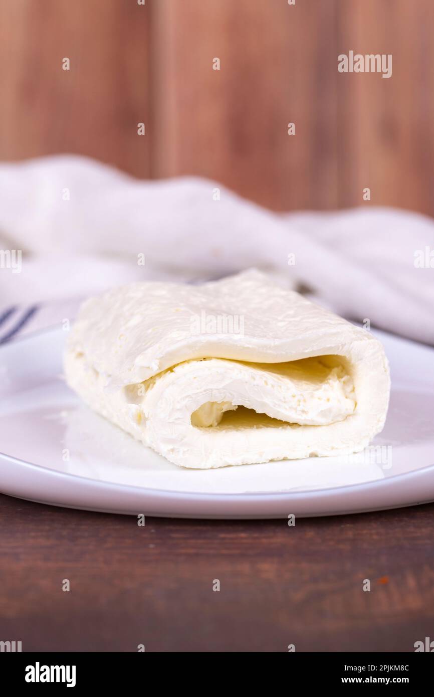 Clotted cream on wood background. Clotted cream (butter cream) for Turkish breakfast. local name inek kaymak. Close up Stock Photo