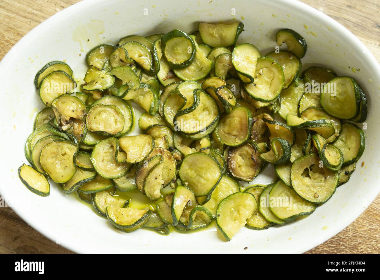 fried chips zucchini in a ceramic bowl Stock Photo