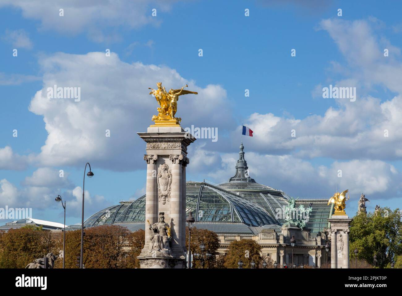 Paris. Statues at Pont Alexandre III, along River Seine. Grand Palais ...