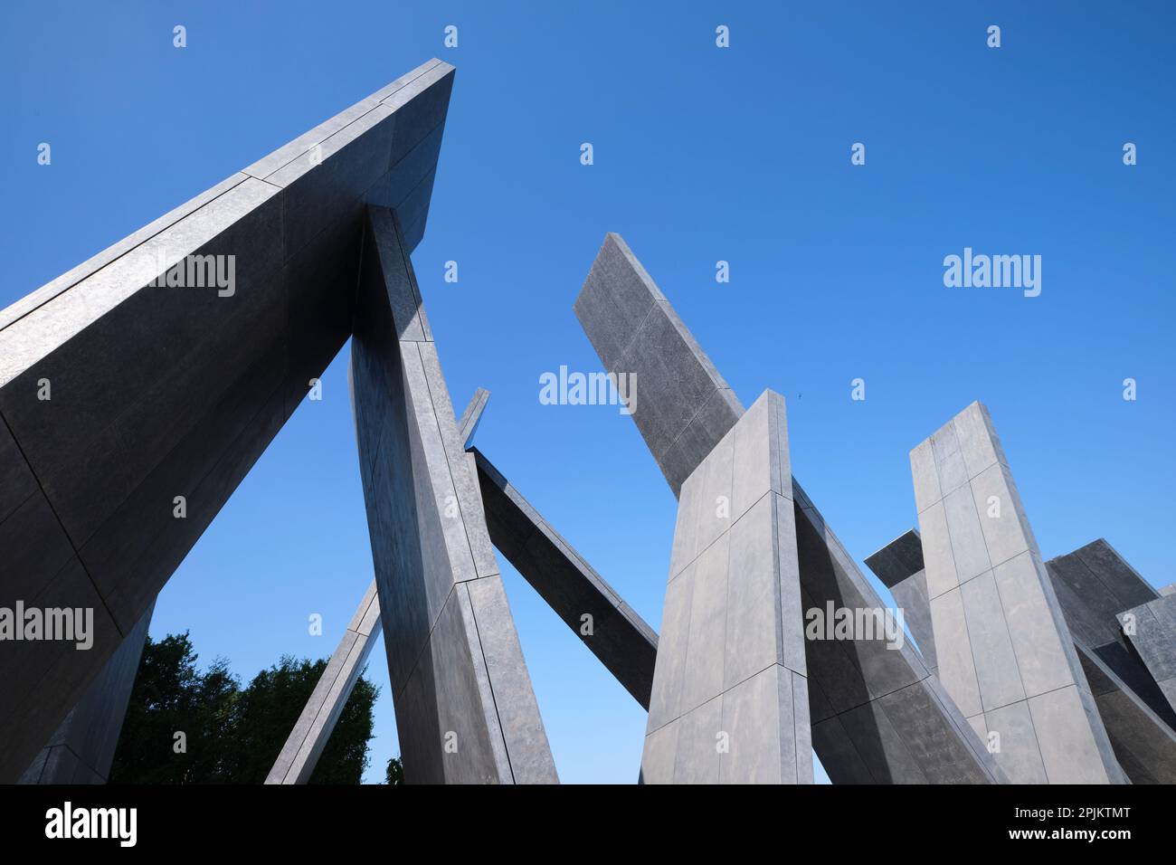 The grey, triangle shape of the artwork. At the Wahat Al Karama ...