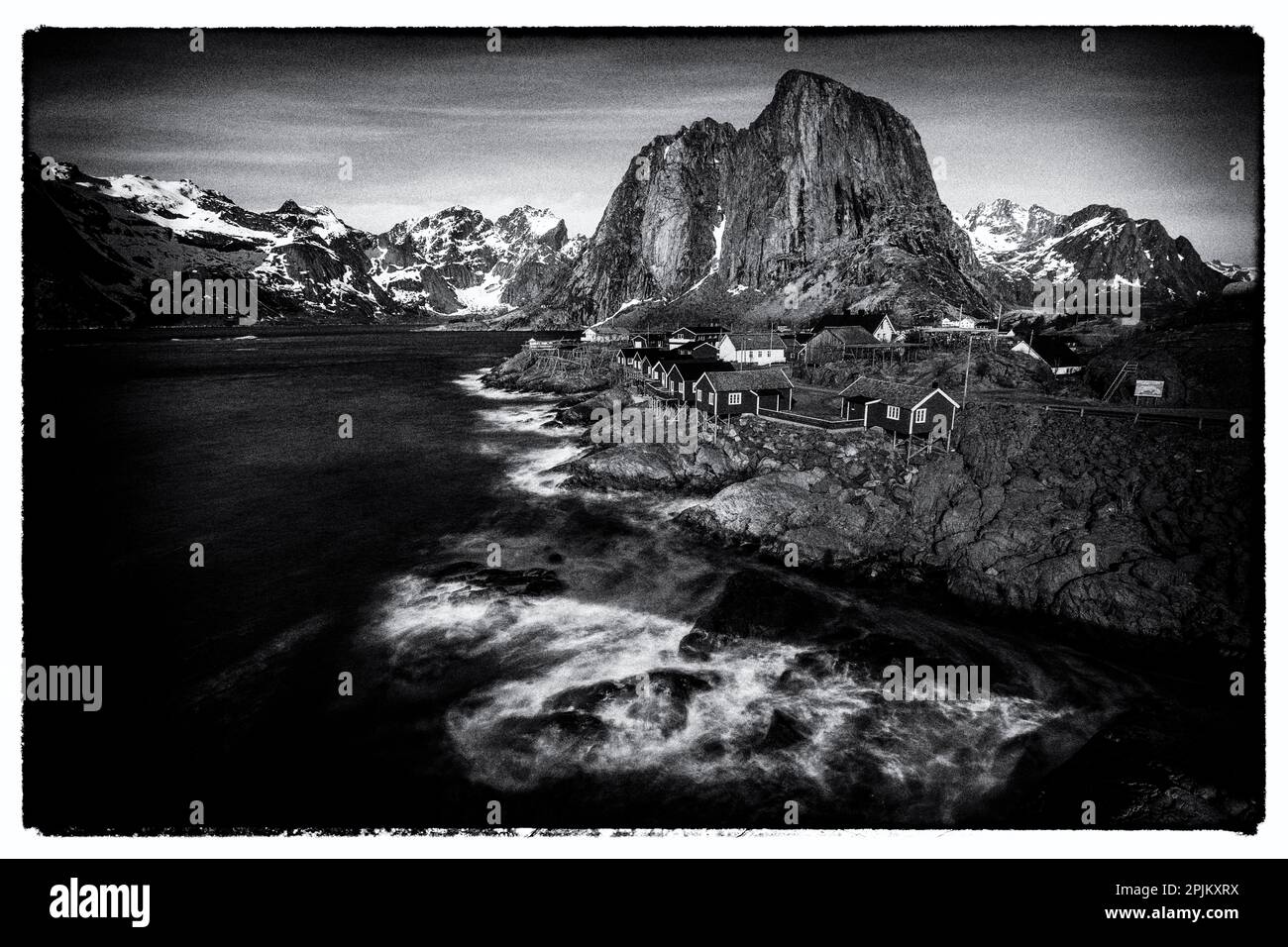 Norway, Lofoten Islands. Hamnoy (Reine), Red Rorbuer (fishermen's cottages) Stock Photo
