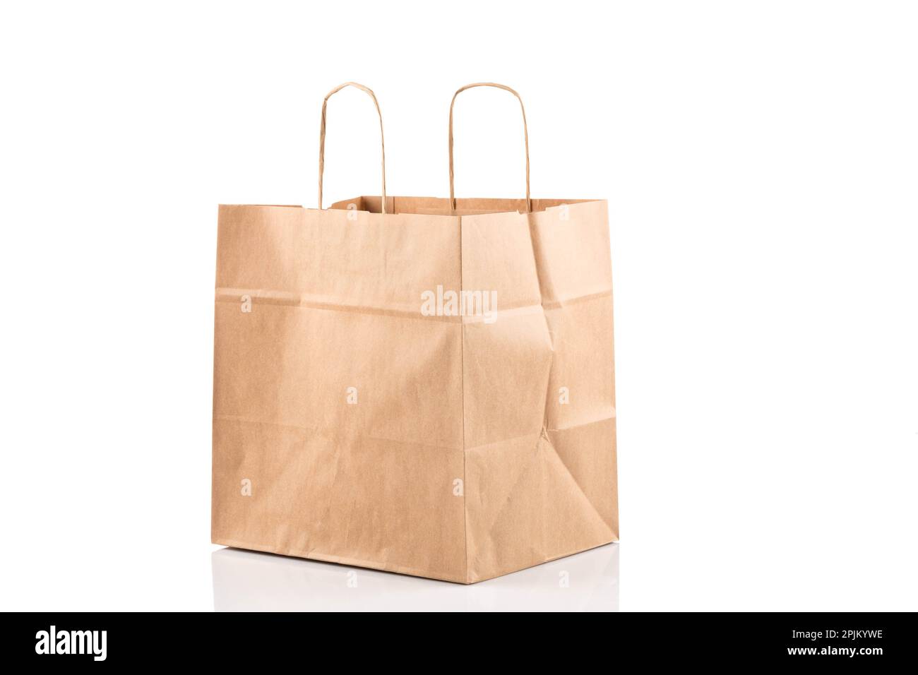 Recycled paper kraft shopping bag. This package bag isolated on white