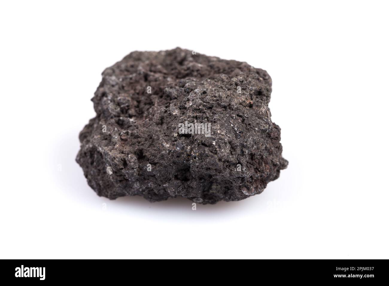 Black lava rock from volcano on a white background Stock Photo - Alamy