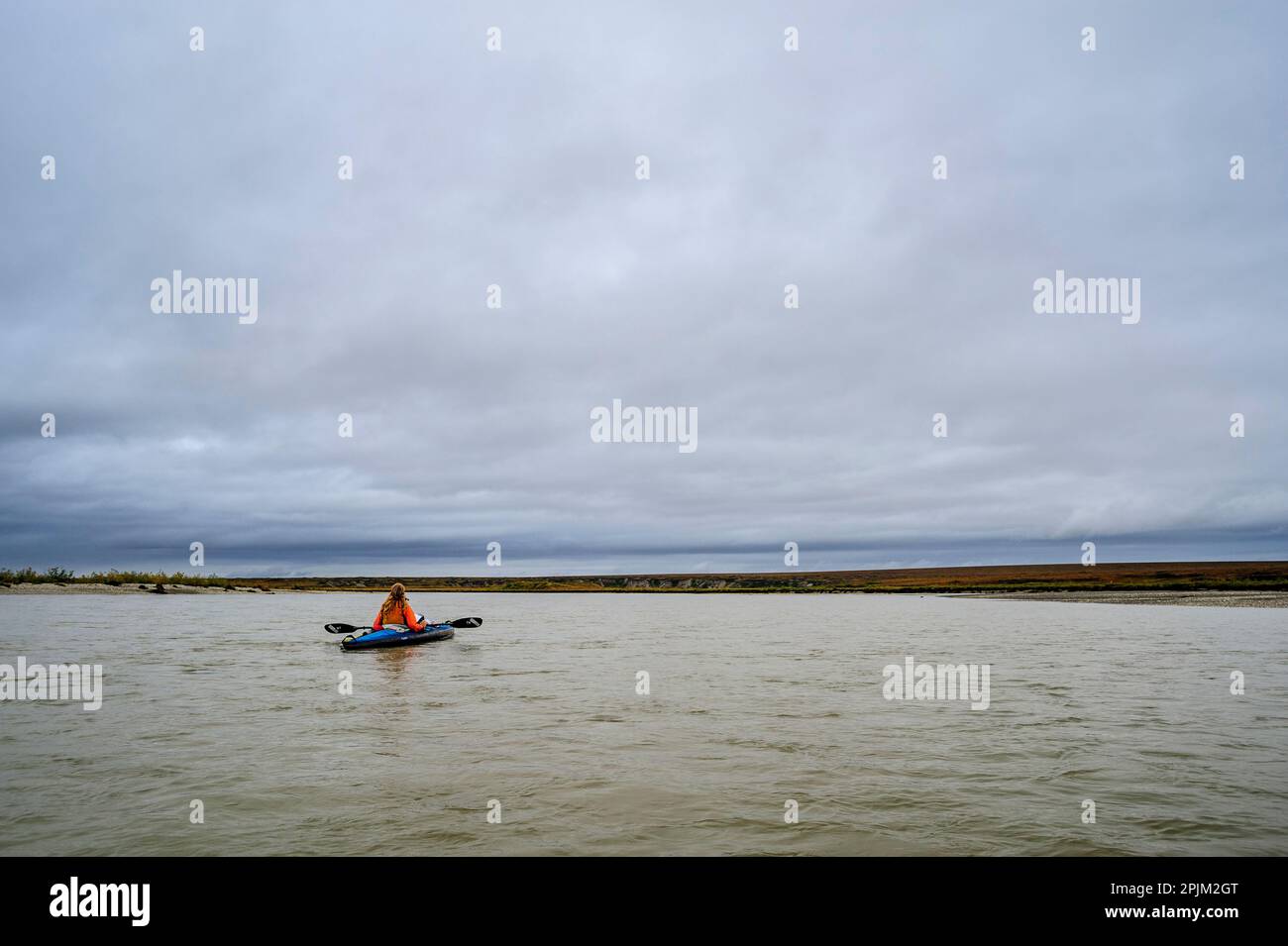 USA, Alaska, Noatak National Preserve. Kayaker on the Noatak River. (MR) Stock Photo