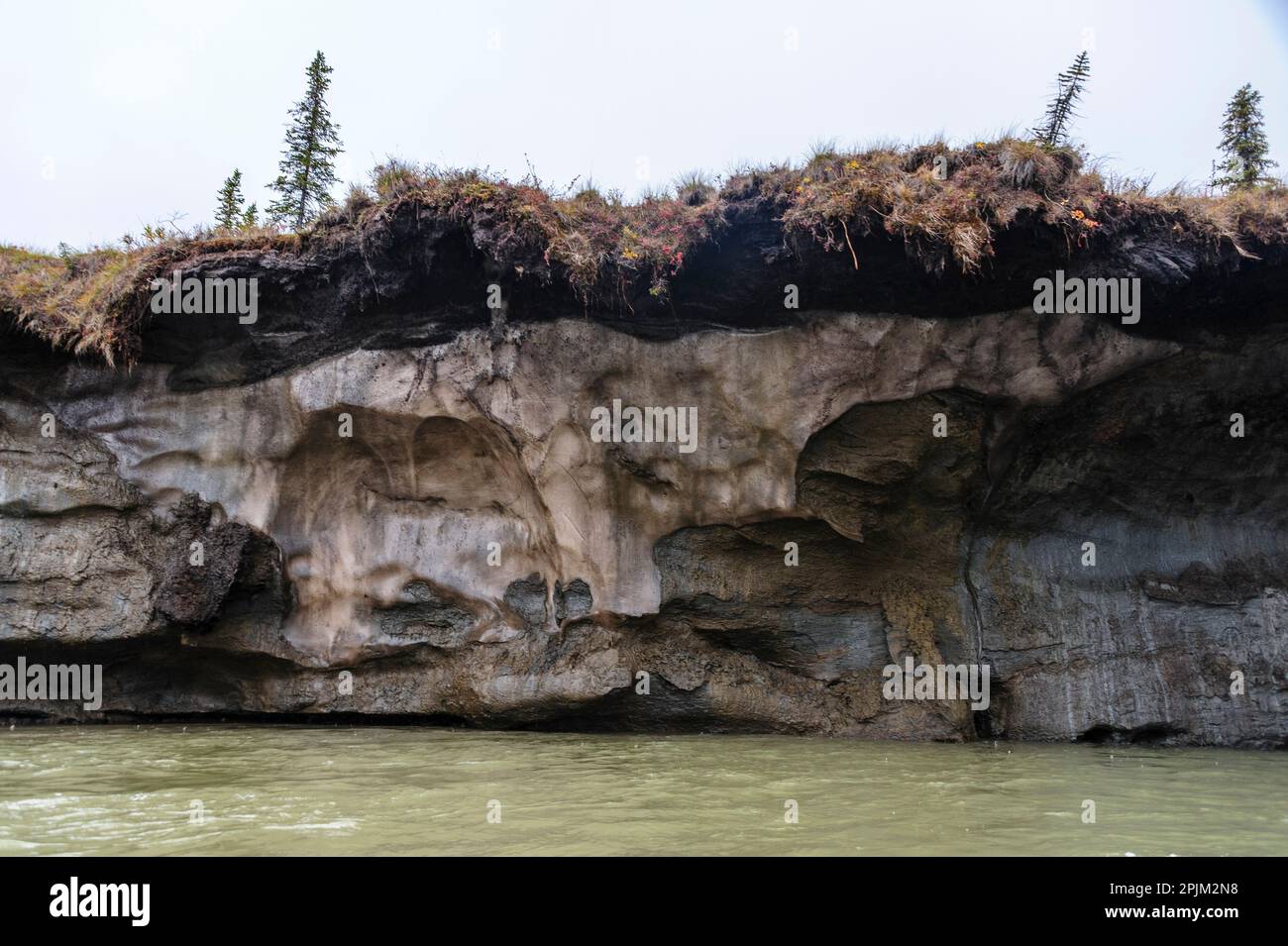 USA, Alaska, Noatak, Noatak River. The river carving a path through permafrost capped with a thin layer of active soil. Stock Photo