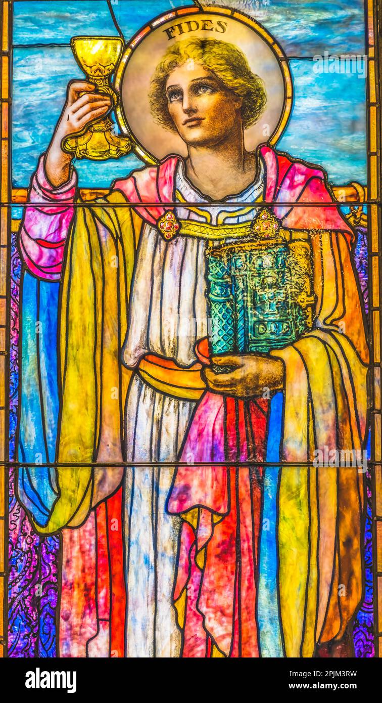 Saint Fides stained glass, Trinity Parish Church, Saint Augustine, Florida. Stained glass from mid-1800's Stock Photo
